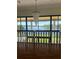 Elegant foyer with wood floors and a chandelier with a lake view at 10843 Lakeshore Dr, Clermont, FL 34711
