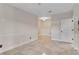 Bright, neutral living room with marble floors at 10843 Lakeshore Dr, Clermont, FL 34711