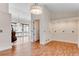 Bright room with hardwood floors, built-in shelving, and water views at 10843 Lakeshore Dr, Clermont, FL 34711