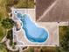 Overhead view of an in-ground pool, patio, and yard at 10843 Lakeshore Dr, Clermont, FL 34711