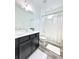 Well-lit bathroom featuring a shower-tub combo and modern vanity at 224 Trinity Ridge Cir, Davenport, FL 33897