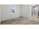 Bright bedroom with a window and neutral carpeting at 224 Trinity Ridge Cir, Davenport, FL 33897
