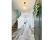 Inviting entryway with wood-look tile flooring and stairs leading to the upper level at 224 Trinity Ridge Cir, Davenport, FL 33897