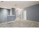 Hallway area with neutral carpet and gray paint at 224 Trinity Ridge Cir, Davenport, FL 33897