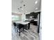 Stylish kitchen with a large island, pendant lighting, and stainless steel appliances at 224 Trinity Ridge Cir, Davenport, FL 33897