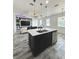Open-concept kitchen with a spacious island and modern appliances at 224 Trinity Ridge Cir, Davenport, FL 33897
