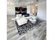 Open-concept living area with sleek tile floors and modern decor at 224 Trinity Ridge Cir, Davenport, FL 33897