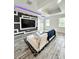 Modern living room featuring a large television and stylish decor at 224 Trinity Ridge Cir, Davenport, FL 33897