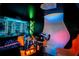 Unique game room with mounted gaming system and decorative Transformer figure at 7487 Gathering Dr, Reunion, FL 34747