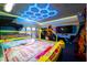 Well-lit game room with classic arcade games for hours of fun at 7487 Gathering Dr, Reunion, FL 34747
