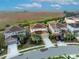 Aerial view of houses with tile roofs in a residential neighborhood at 6078 Broad Oak Dr, Davenport, FL 33837