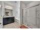 Modern bathroom with soaking tub, shower, and dark vanity at 6078 Broad Oak Dr, Davenport, FL 33837