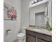 Simple bathroom with toilet, vanity, and granite countertop at 6078 Broad Oak Dr, Davenport, FL 33837