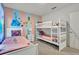 Bedroom with twin beds and playful decor at 6078 Broad Oak Dr, Davenport, FL 33837