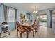 Bright dining room with table, chairs, and view of the pool at 6078 Broad Oak Dr, Davenport, FL 33837