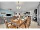 Elegant dining room with a large wood table and chandelier at 6078 Broad Oak Dr, Davenport, FL 33837