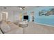 Bright game room featuring a sectional sofa and a large TV at 6078 Broad Oak Dr, Davenport, FL 33837