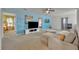 Spacious game room with comfortable seating and a large TV at 6078 Broad Oak Dr, Davenport, FL 33837