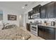 Kitchen with granite countertops, stainless steel appliances and subway tile backsplash at 6078 Broad Oak Dr, Davenport, FL 33837