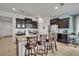 Kitchen boasts granite countertops, stainless steel appliances, and an island with seating at 6078 Broad Oak Dr, Davenport, FL 33837