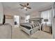 Main bedroom with a large bed and ensuite bathroom at 6078 Broad Oak Dr, Davenport, FL 33837
