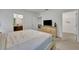 Main bedroom with a large bed, dresser, and walk-in closet at 6078 Broad Oak Dr, Davenport, FL 33837