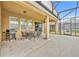 Covered patio with seating and grill at 6078 Broad Oak Dr, Davenport, FL 33837