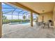 Relaxing pool and spa area with patio furniture at 6078 Broad Oak Dr, Davenport, FL 33837