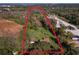 Aerial view of property showing house and surrounding land at 12 Lee St, Ocoee, FL 34761