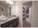 Stylish bathroom with granite counters offers a glimpse into a themed bedroom at 4189 Lana Ave, Davenport, FL 33897