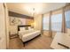 Modern bedroom with a sleek headboard, contemporary lighting, and large windows for natural light at 4189 Lana Ave, Davenport, FL 33897