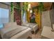 Fun Jurassic Park-themed bedroom with hanging lights and greenery, ideal for  at 4189 Lana Ave, Davenport, FL 33897