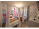 Charming princess-themed bedroom with canopy beds and whimsical decor at 4189 Lana Ave, Davenport, FL 33897