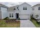 Charming two-story home features a two-car garage and well-maintained landscaping at 4189 Lana Ave, Davenport, FL 33897