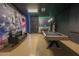 Entertainment space with pool table, basketball mural, LED lighting, and comfortable seating at 4189 Lana Ave, Davenport, FL 33897
