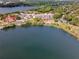 Aerial view showcasing the property near a serene lake and lush greenery, offering picturesque scenery at 1110 W Ivanhoe Blvd # 6, Orlando, FL 32804