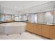 Bathroom features a sunken tub, double sinks, marble floors, granite countertops, and decorative lighting at 1110 W Ivanhoe Blvd # 6, Orlando, FL 32804