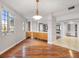 A bright and open concept living room features hardwood floors and high ceilings at 1110 W Ivanhoe Blvd # 6, Orlando, FL 32804