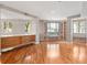 Spacious living room with hardwood floors, large windows, and built in shelves surrounding a window seat at 1110 W Ivanhoe Blvd # 6, Orlando, FL 32804