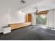 Living room features modern ceiling fan, with large slider providing natural light at 1110 W Ivanhoe Blvd # 6, Orlando, FL 32804