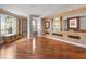 The living room features hardwood floors, natural light, and built-in shelving at 1110 W Ivanhoe Blvd # 6, Orlando, FL 32804
