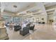 Bright lounge area featuring comfortable seating, elegant chandeliers, and expansive windows at 1110 W Ivanhoe Blvd # 6, Orlando, FL 32804