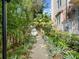 Walkway leading up to the building lined with plants at 1110 W Ivanhoe Blvd # 6, Orlando, FL 32804