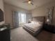 Spacious bedroom with king-size bed and large window at 7740 Sandy Ridge Dr # 217, Reunion, FL 34747