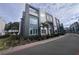 Modern three-story townhome with blue and gray siding at 7740 Sandy Ridge Dr # 217, Reunion, FL 34747