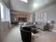 Open concept living room with kitchen view at 7740 Sandy Ridge Dr # 217, Reunion, FL 34747