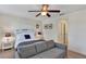 Bright, serene bedroom with a comfortable queen-sized bed, soft lighting, and a soothing color palette at 9149 Outlook Rock Trl, Windermere, FL 34786