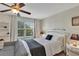 Bright bedroom featuring a cozy bed, natural light, and stylish decor creating a relaxing atmosphere at 9149 Outlook Rock Trl, Windermere, FL 34786
