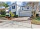 Charming two-story home featuring a two-car garage, brick driveway, and well-maintained landscaping at 9149 Outlook Rock Trl, Windermere, FL 34786