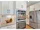 Modern kitchen featuring stainless steel appliances and neutral countertops at 9149 Outlook Rock Trl, Windermere, FL 34786